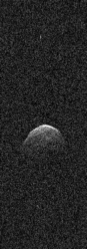 A radar image shows asteroid 3122 Florence and tiny echoes from its two moons.