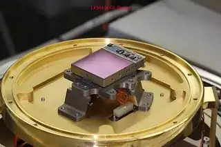 Figure 1: A James Webb Space Telescope Near Infrared Camera (NIRCam) detector with optical baffles removed. Light is collected in the purple mercury-cadmium-telluride film. The film is pixelated, although the individual pixels are far too small to be seen by eye here. Credit: University of Arizona/NASA