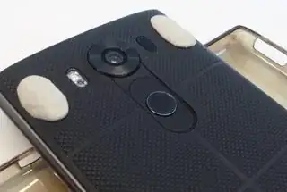 Phone back with gum-tack stuck on the back