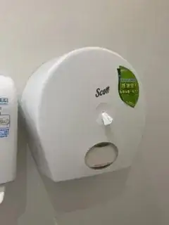 Toilet paper dispenser with hole in the middle
